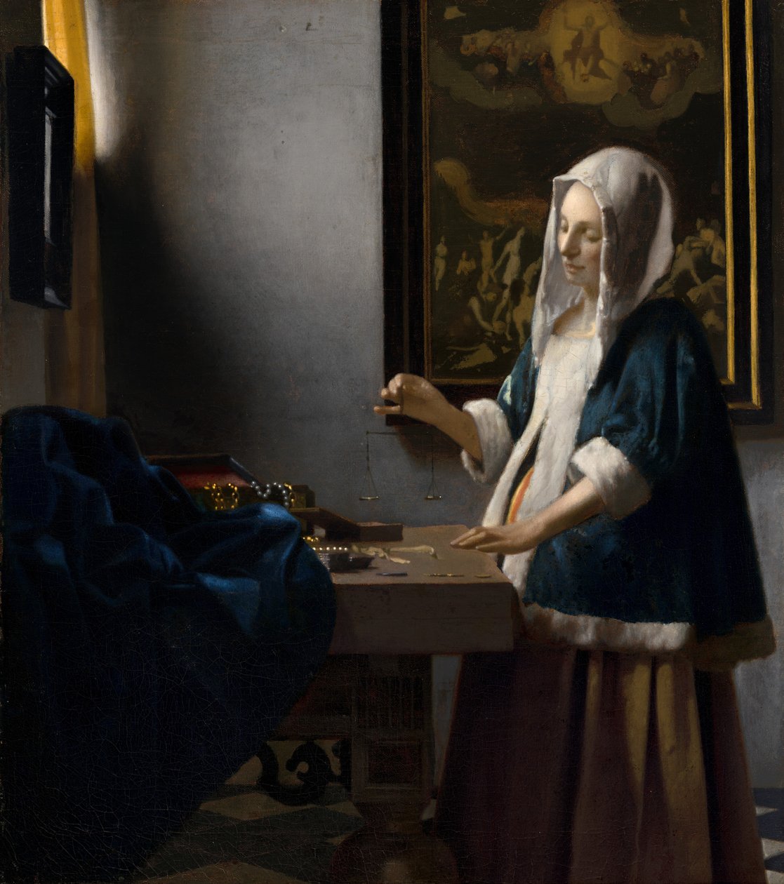 Nainen pitelee tasapainoa tekijältä Johannes Vermeer